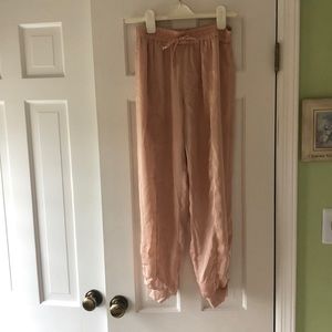 Free people movement satin joggers in champagne